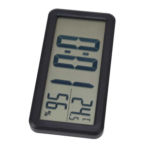Digital Alarm Clock with a black plastic frame, showing large LCD digits and temperature and humidity readings