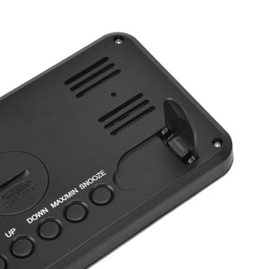 Digital Alarm Clock in black ABS plastic, showing rear controls, speaker vents, screws and a fold-out stand