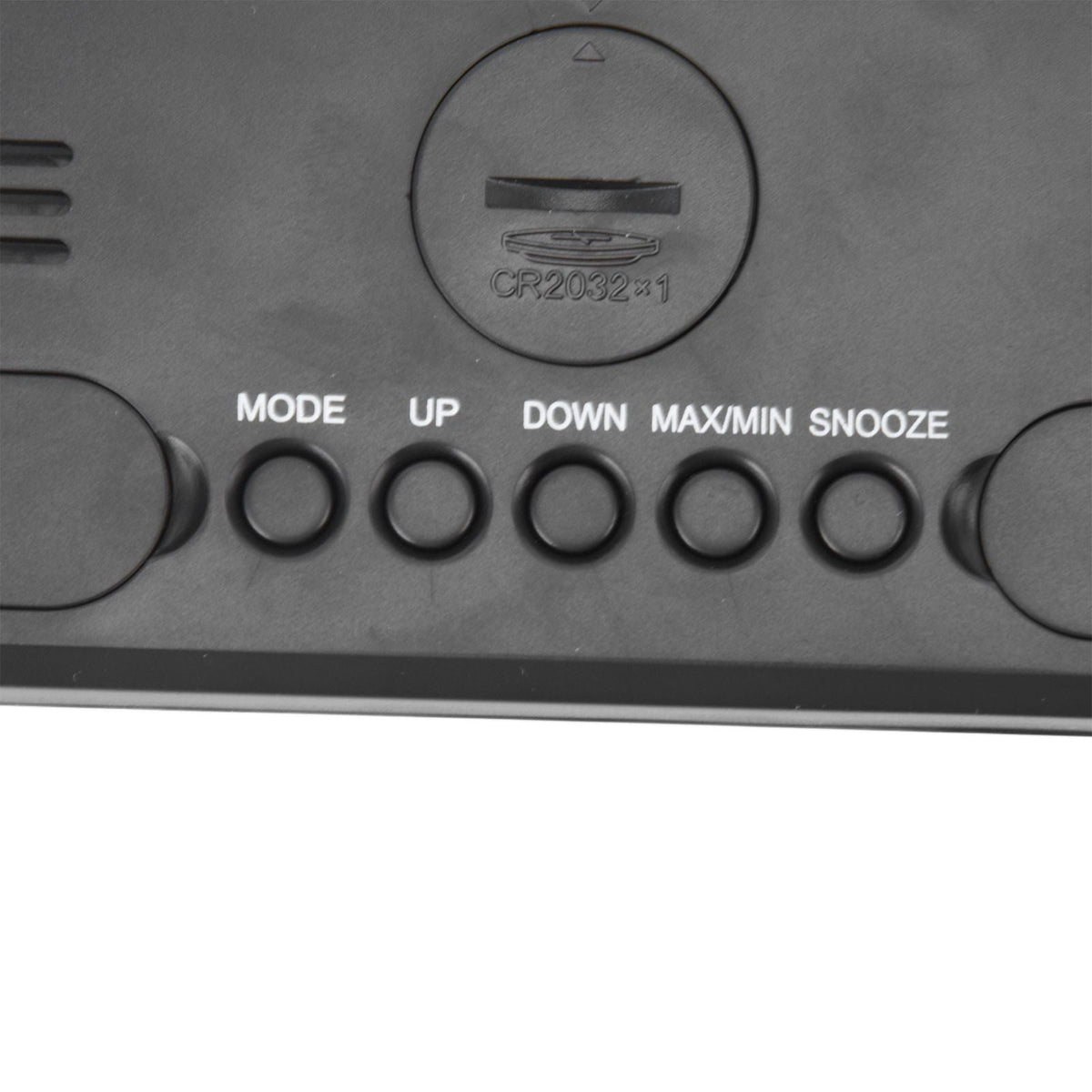 Digital Alarm Clock with a black plastic back, CR2032 battery compartment and MODE, UP, DOWN, MAX/MIN and SNOOZE buttons