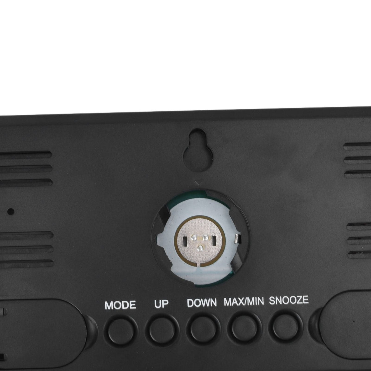 Digital Alarm Clock rear casing in black ABS plastic with battery compartment, control buttons, vent slots and wall hanging hole
