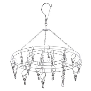 Clothes Hanger drying rack in silver stainless steel, with a circular frame, hanging chains and multiple spring clips