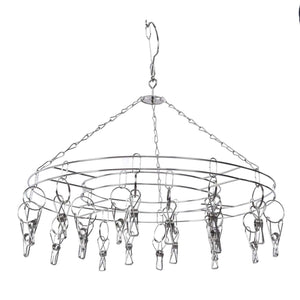 Clothes Hanger drying rack in silver stainless steel, with a circular frame, hanging chain and multiple metal clips