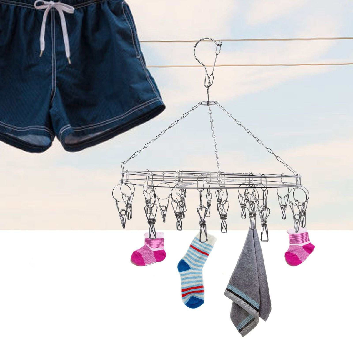 Clothes Hanger drying rack in silver stainless steel, with hanging clips holding colourful socks and a grey towel