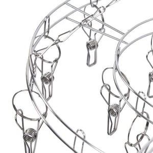 Clothes Hanger drying rack in shiny stainless steel, featuring a circular frame with numerous spring clips for small garments