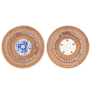 Blue and White Porcelain Coaster with a blue floral porcelain center and a natural tan woven rattan rim