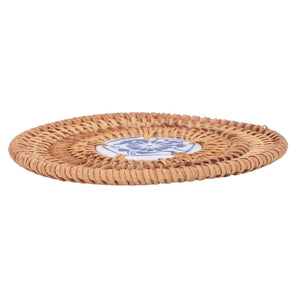 Blue and White Porcelain Coaster with a natural tan woven rattan rim and a blue floral porcelain centre