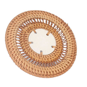 Blue and White Porcelain Coaster with a pale porcelain center and a round natural tan rattan weave border