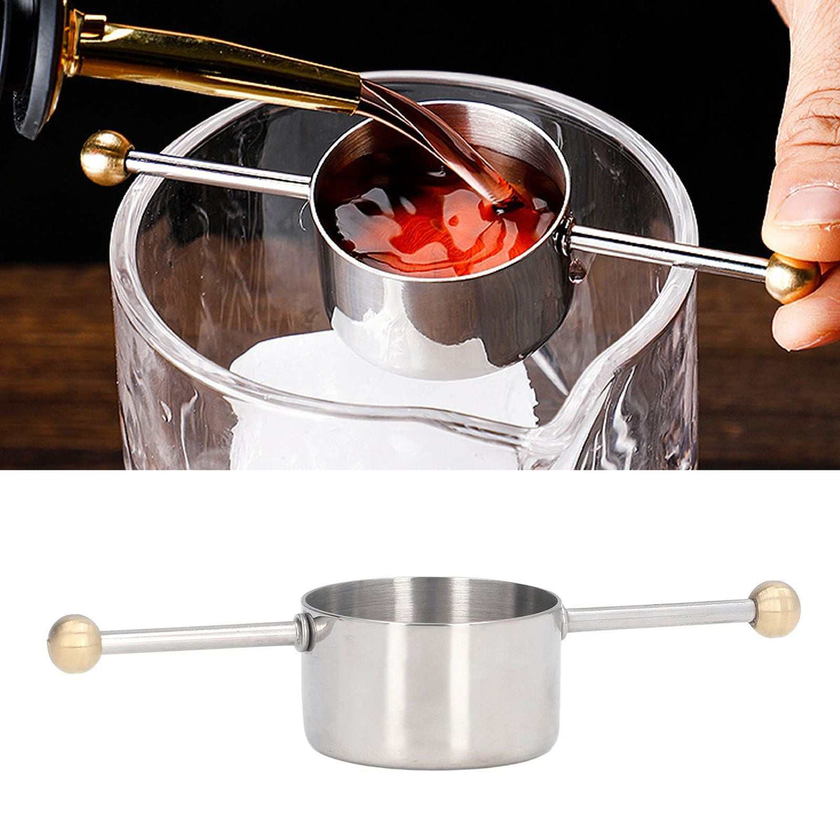 Stainless Steel Measuring Cup with polished metal finish, cylindrical jigger bowl and long double ball handle shown measuring a drink