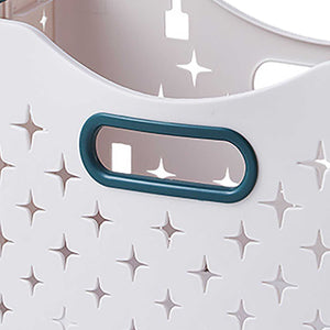 Collapsible Laundry Basket detail with a white molded plastic panel, raised star pattern and dark teal oval handle