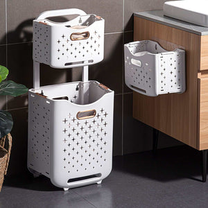 Collapsible Laundry Basket in white plastic with star-shaped ventilation cutouts, copper-tone handles and a fold-flat design
