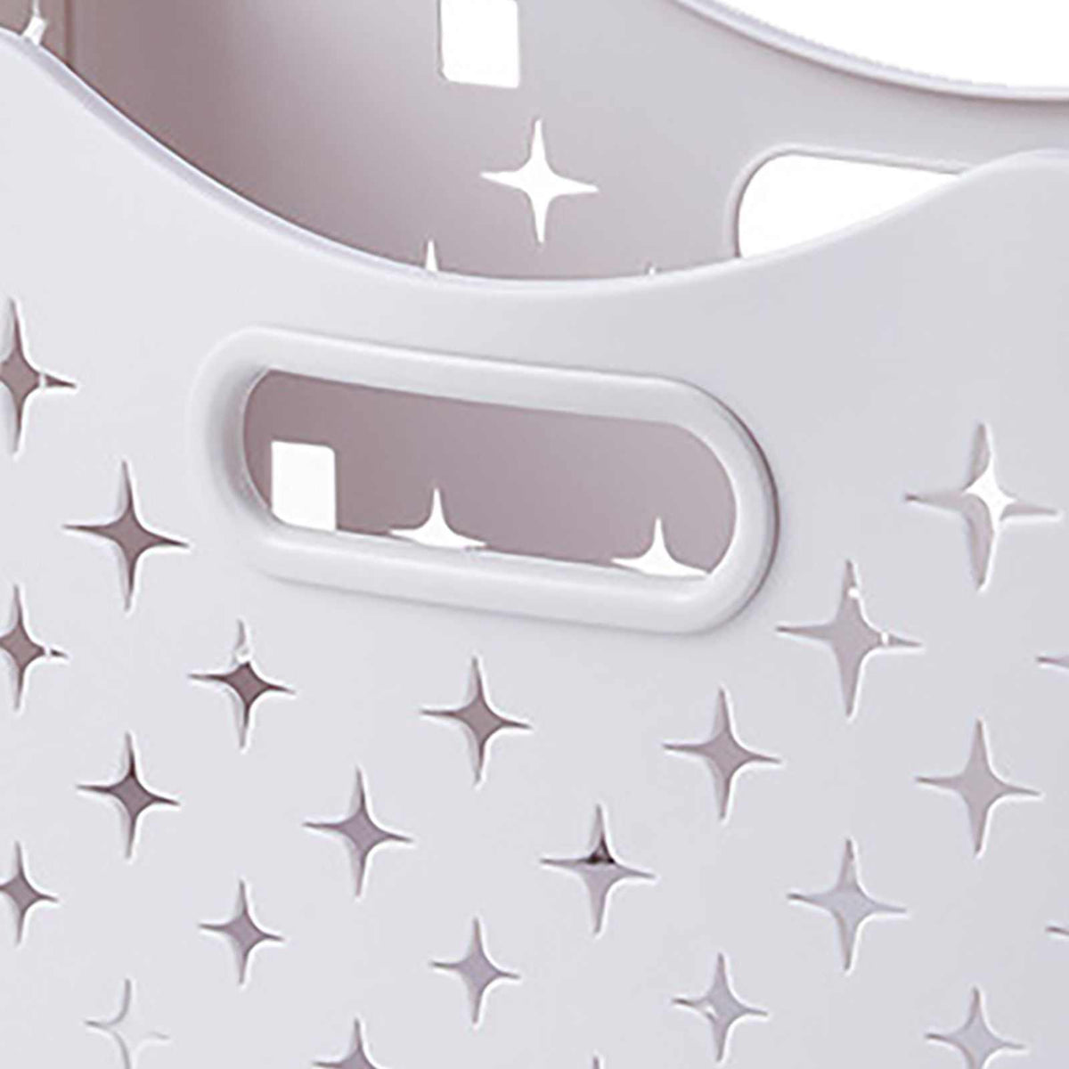 Collapsible Laundry Basket in ivory white plastic with a molded oval handle and decorative star-shaped ventilation holes