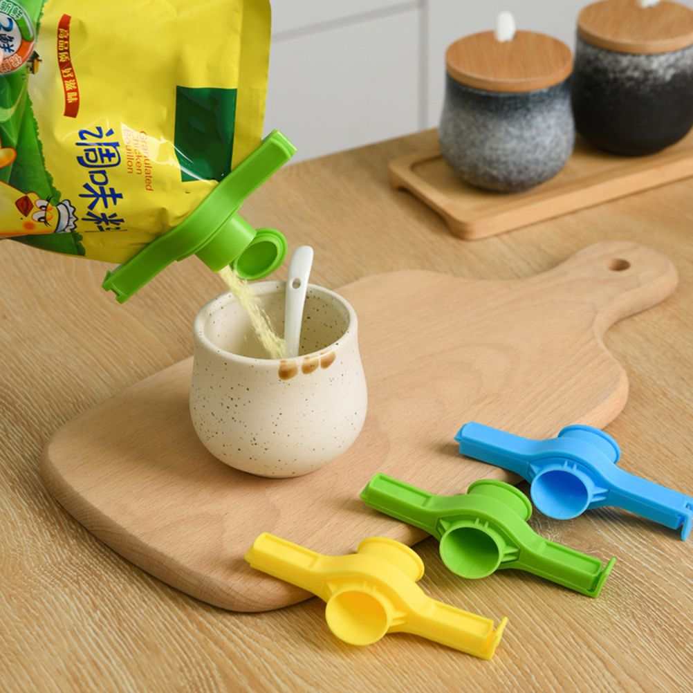 Random Food Bag sealing clips in green, blue and yellow plastic, each with an integrated pouring nozzle