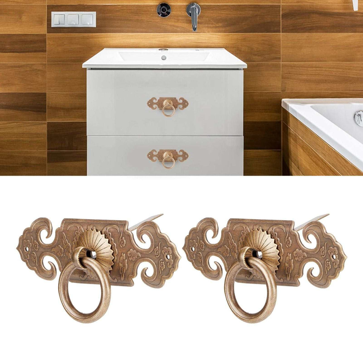 Bat-Shaped Handle pair in antique bronze metal, with ornate scrollwork backplates and decorative circular ring pulls.