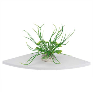 Floating Corner Shelf in white PVC with a smooth triangular platform and rounded front edge, displaying a small green plant