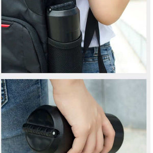 Portable Folding Stool shown folded into a compact black cylinder, with a ridged circular end and carry handle