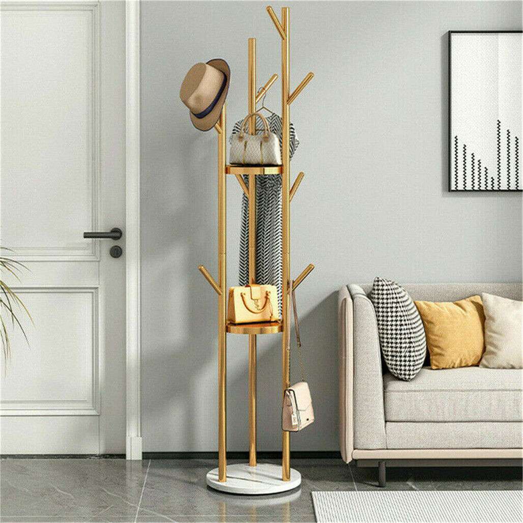 Marble & Metal Coat Rack with a gold tree-frame stand, white round base, branching hooks and attached storage baskets