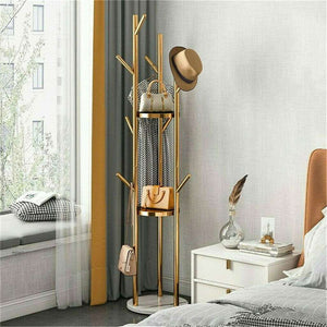 Marble & Metal Coat Rack with slender gold metal branches, a white marble base and multiple hooks displaying accessories