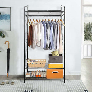 Extra Large Iron Clothes Rack in black metal with a hanging rod, upper wire shelf and two lower shelves, holding clothes and shoes