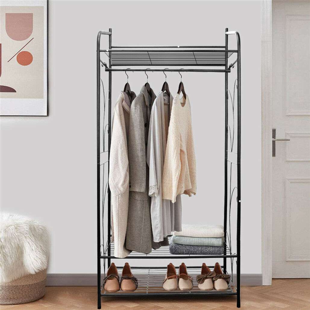 Extra Large Iron Clothes Rack in black metal with curved sides, a hanging rail and three wire shelves holding clothes, shoes and linens