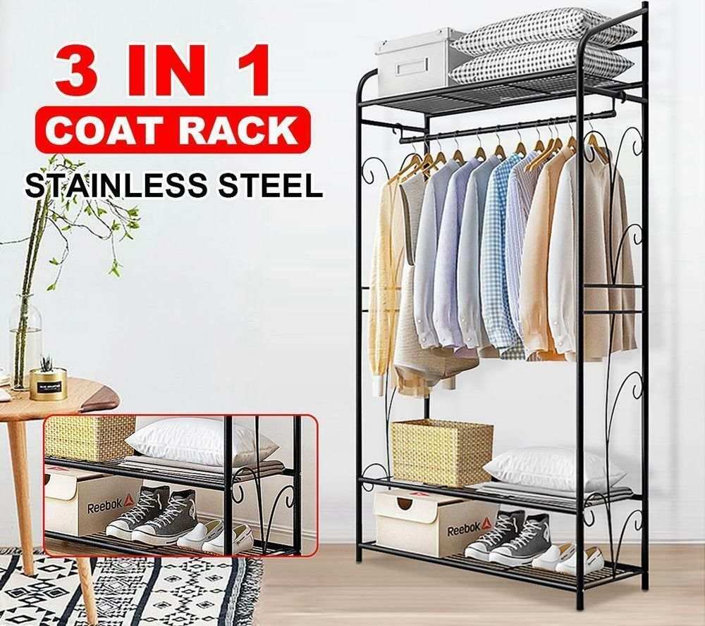 Extra Large Iron Clothes Rack with black metal frame, hanging rod, ornate side scrolls and three storage shelves