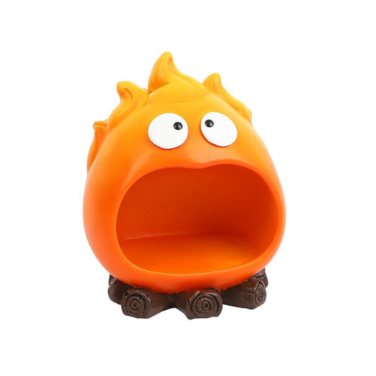 Creative Cartoon Flame Key Holder Tray in bright orange resin, with a wide open mouth and small brown wood-look base