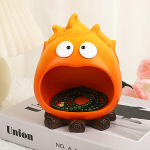 Creative Cartoon Flame Key Holder Tray in bright orange resin, with wide open mouth, googly eyes and brown stump-like feet