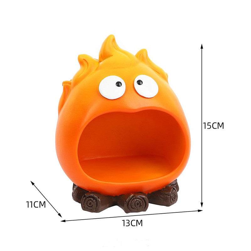 Creative Cartoon Flame Key Holder Tray in bright orange resin, with playful eyes, a wide open pocket and brown log-style base