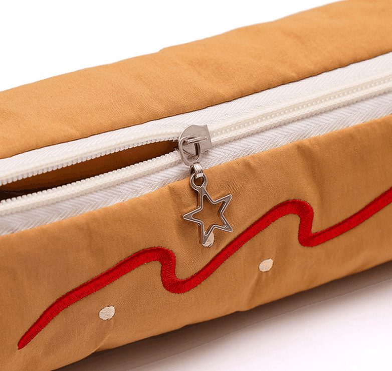 Coffee Vibrant Color Block pencil case in tan fabric with red embroidered wavy trim, white zipper and star-shaped pull