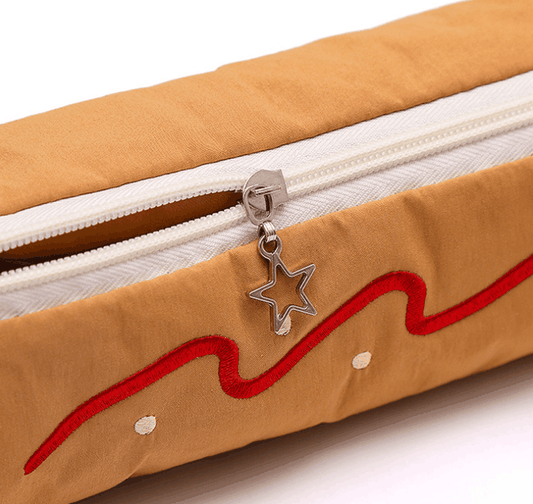 Coffee Vibrant Color Block pencil case in tan fabric with red embroidered wavy trim, white zipper and star-shaped pull
