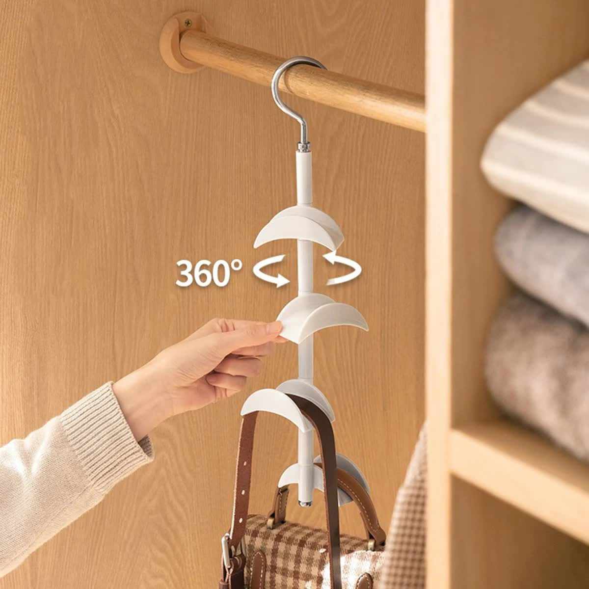 2-Pack Black 360 Degree rotating wardrobe hook rack with four curved tiers holding handbags and straps.