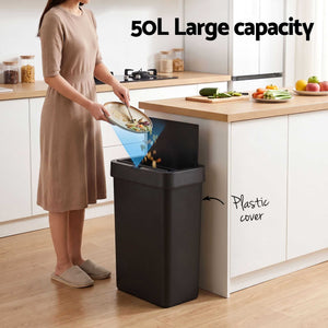 Sensor rubbish bin in black plastic with a slim rectangular shape and open lid, shown with 50L capacity