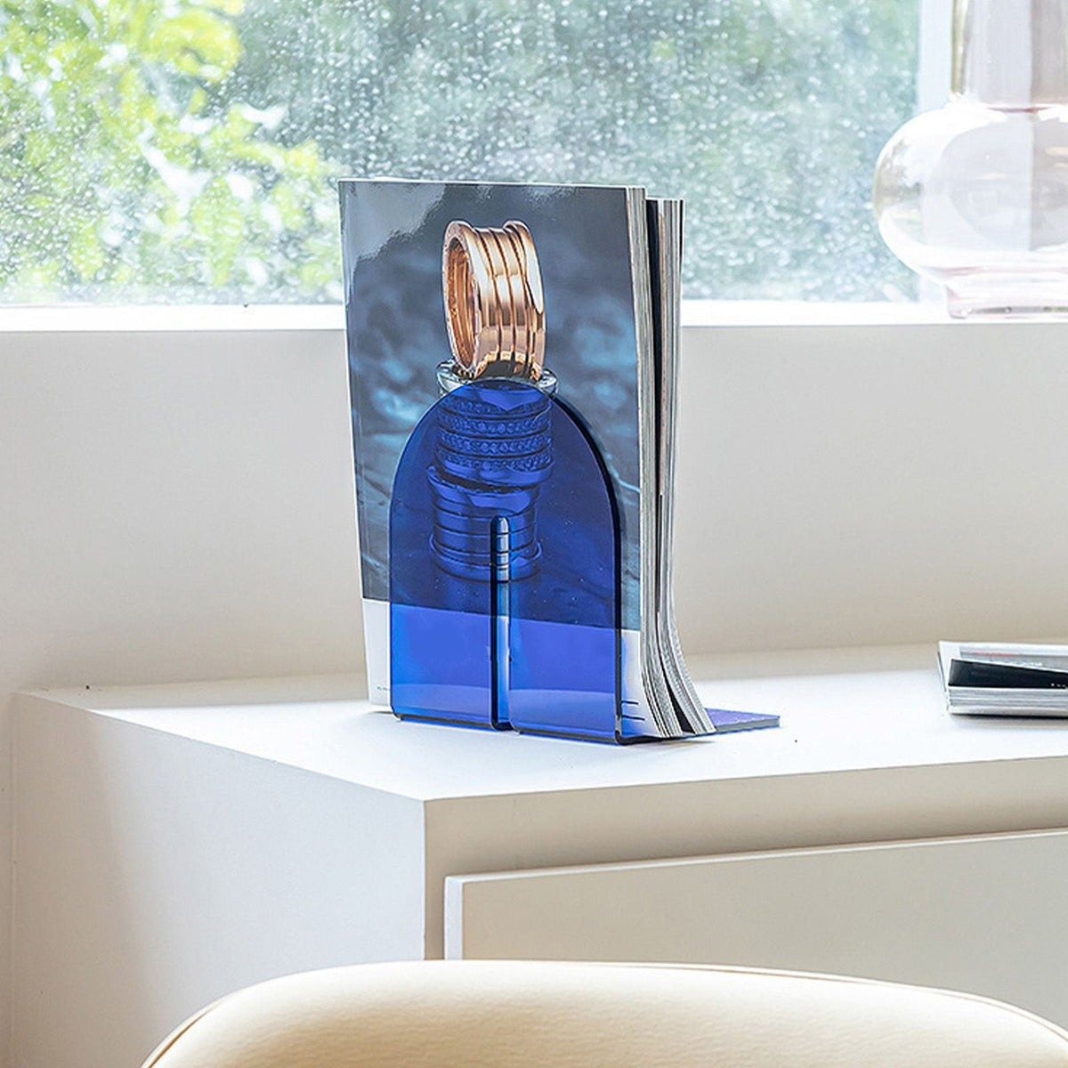 Acrylic Book End in translucent blue acrylic, with a thick L-shaped design holding books upright securely