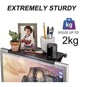 Adjustable Monitor Stand in black with a slim non-slip shelf, holding desk accessories above a monitor