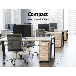 Artiss Filing Cabinet in light wood-grain finish with five slim drawers, silver handles and black caster wheels beside office desks