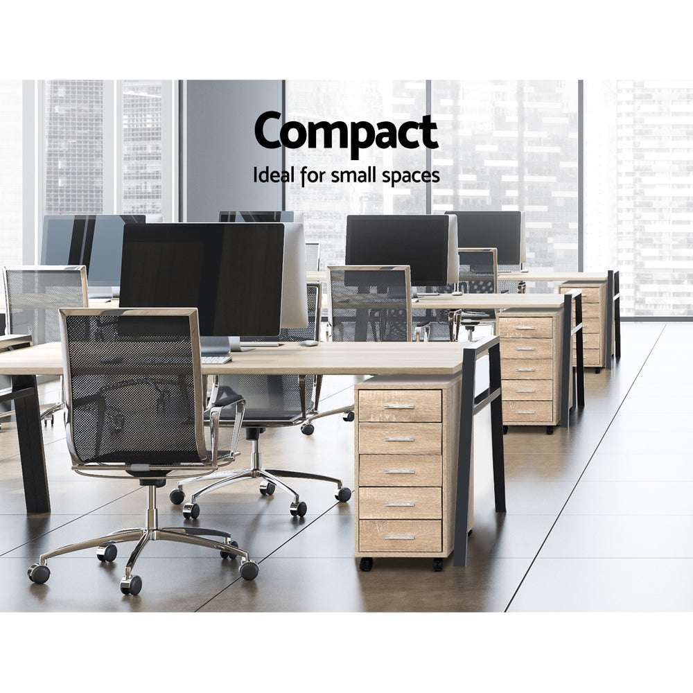 Artiss Filing Cabinet in light wood-grain finish with five slim drawers, silver handles and black caster wheels beside office desks