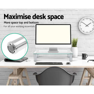 Artiss Monitor Stand Riser with a clear tempered glass platform and silver cylindrical aluminium legs for desk storage