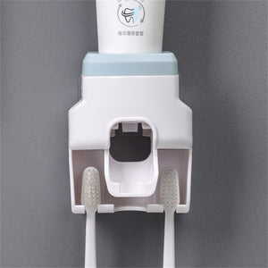 Automatic Toothpaste Dispenser with white ABS plastic body, pale blue top and two integrated toothbrush slots