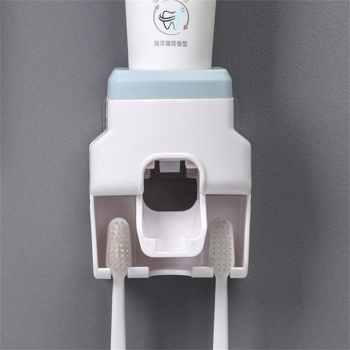 Automatic Toothpaste Dispenser with white ABS plastic body, pale blue top and two integrated toothbrush slots