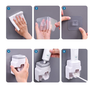Automatic Toothpaste Dispenser in white plastic with a grey top, adhesive wall mount and integrated toothbrush holder shown in use