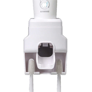 Automatic Toothpaste Dispenser in white ABS plastic, with a central dispensing nozzle and two integrated toothbrush holders