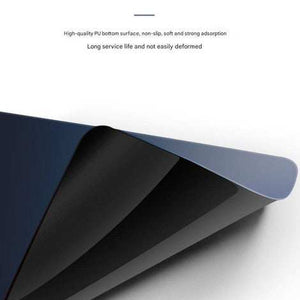 Beige Premium Large Silicone Mouse Pad showing a flexible black non-slip PU base beneath a blue-grey mat surface