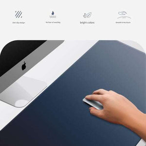 Beige Premium Large Silicone Mouse Pad appears deep navy blue with a smooth surface and rounded corners, shown under a hand using a mouse