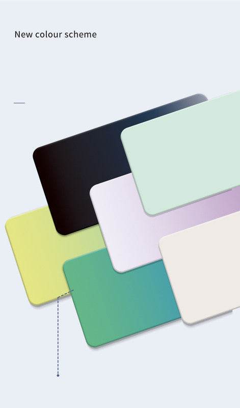 Beige Premium Large Silicone Mouse Pad is shown in a pale beige colour with a smooth, solid surface among colourful pads.