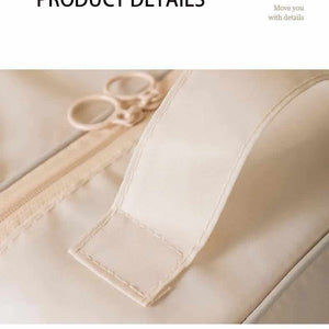Beige Waterproof Foldable Travel shoe bag with smooth beige waterproof fabric, neat wrapped edges and a reinforced stitched handle tab