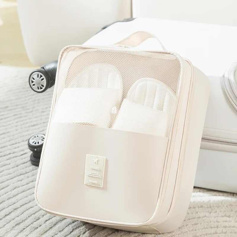 Shoe bag, Beige Waterproof Foldable Travel style, in pale beige fabric with a mesh panel and zip closure.