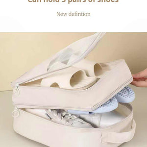 Beige Waterproof Foldable Travel shoe organiser in waterproof fabric, shown open with three separated compartments for footwear.