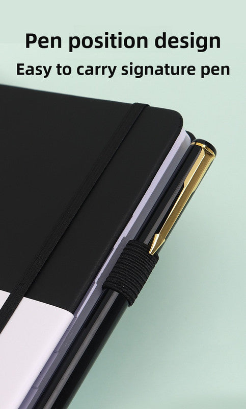 Black Address Book with a smooth black hardcover, elastic closure band and ribbed pen loop holding a black and gold pen