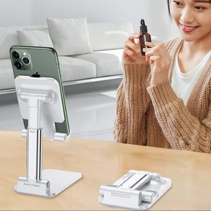 Black Adjustable Desktop Phone Stand with a white foldable telescopic frame, holding a smartphone upright