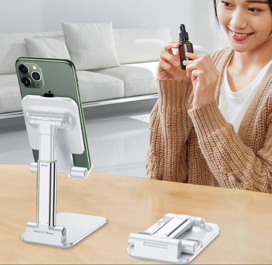 Black Adjustable Desktop Phone Stand with a white foldable telescopic frame, holding a smartphone upright