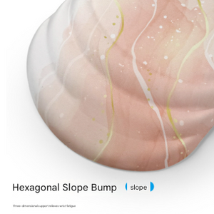 Black Ergonomic Mouse Pad with a pale peach and cream marbled surface, raised contoured wrist support, and hexagonal slope bump design